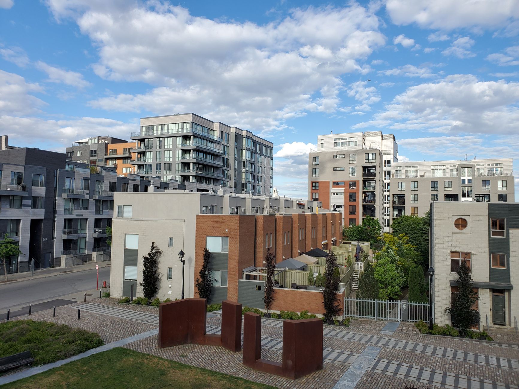 Residential complex in Montreal featuring modern architecture under a clear sky.