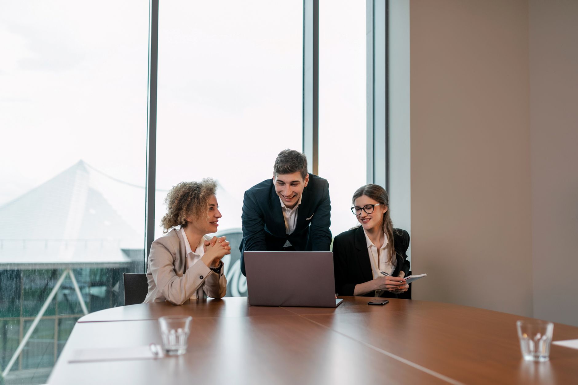 A diverse team of professionals working together in a bright modern office setting.