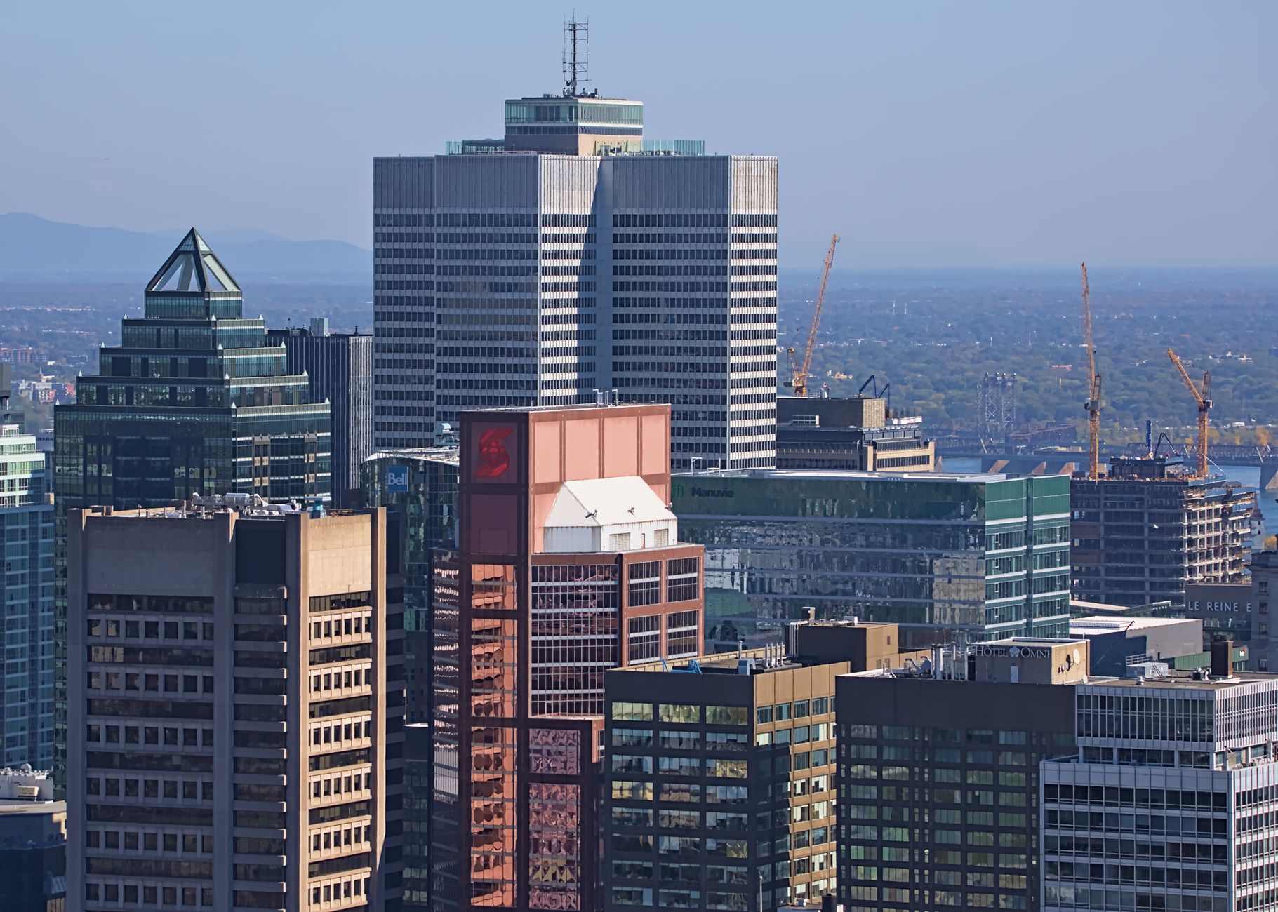 Aerial view of Montreal's downtown skyline featuring modern skyscrapers and urban architecture.